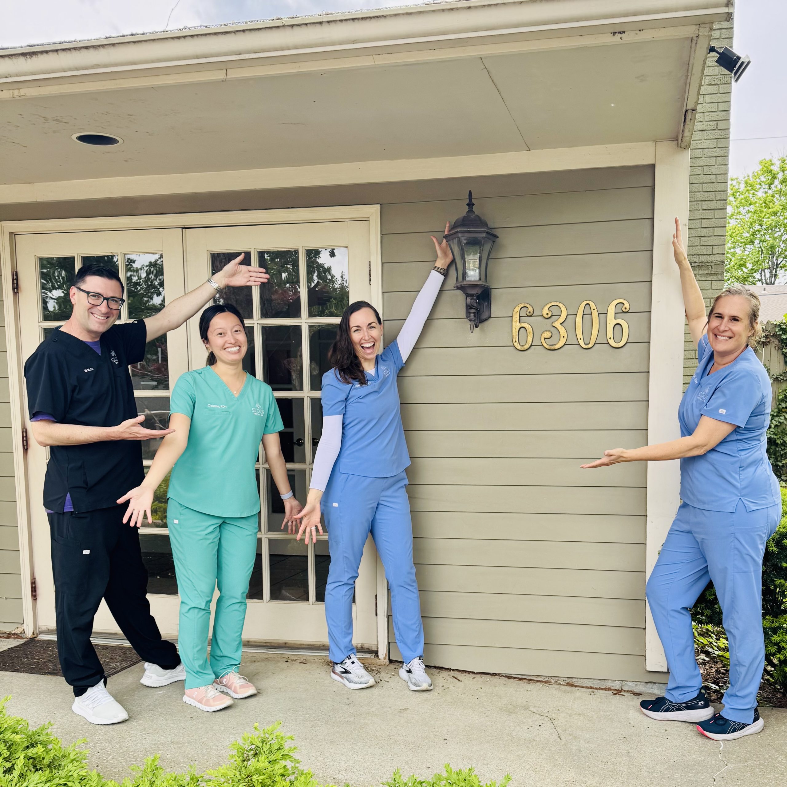 Sloop Dental team in front of 6306 office building.